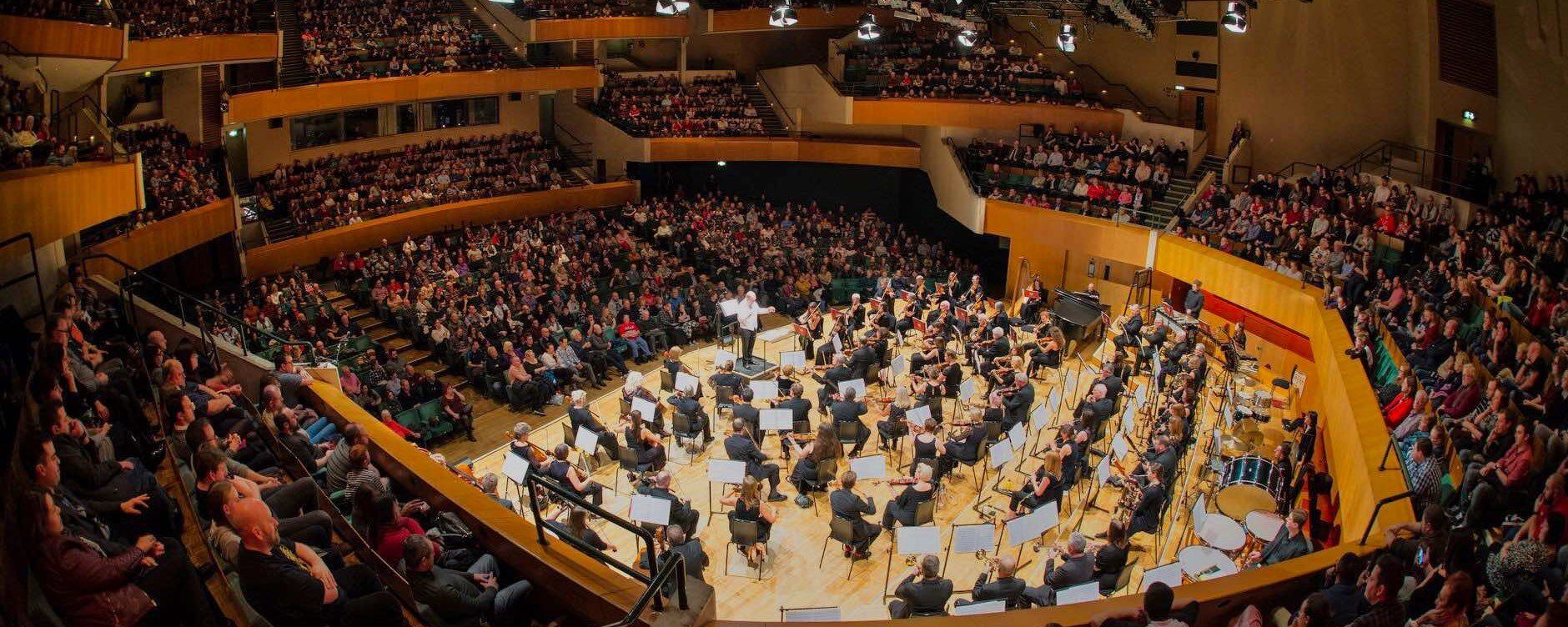 Wide angle view of stage and audience at St. David's Hall