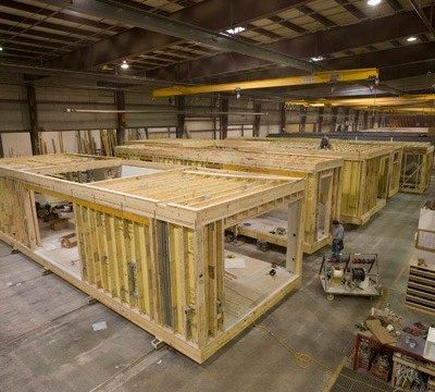 A large warehouse filled with lots of wooden boxes.