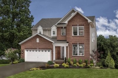 A large brick house with a white garage door