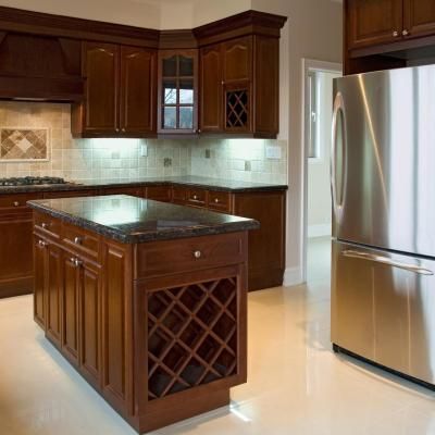 A kitchen with stainless steel appliances and wooden cabinets