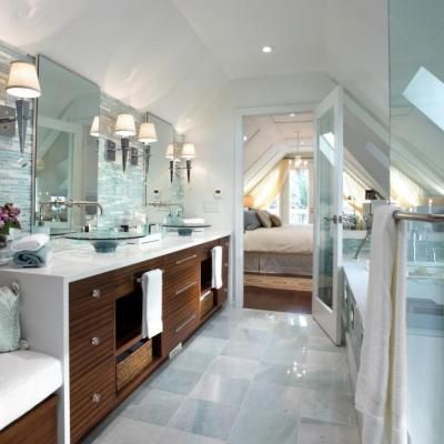 A bathroom with two sinks and a large mirror