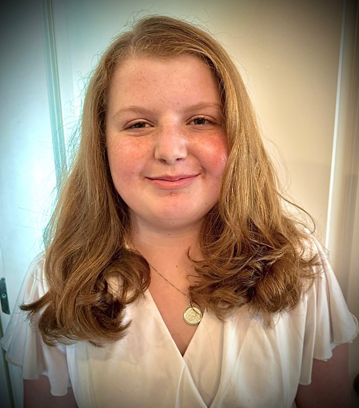 A woman in a black dress is playing a violin