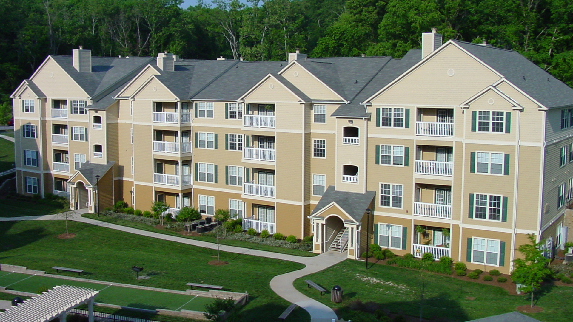 a large apartment building with lots of windows and balconies