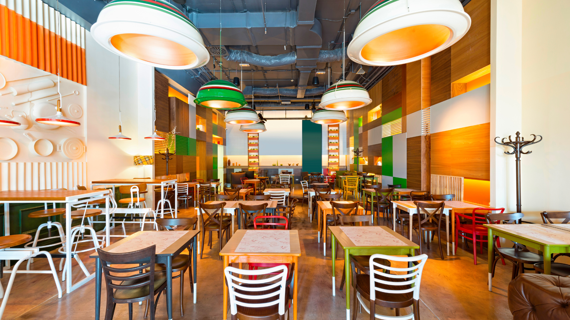 there are many tables and chairs in the restaurant