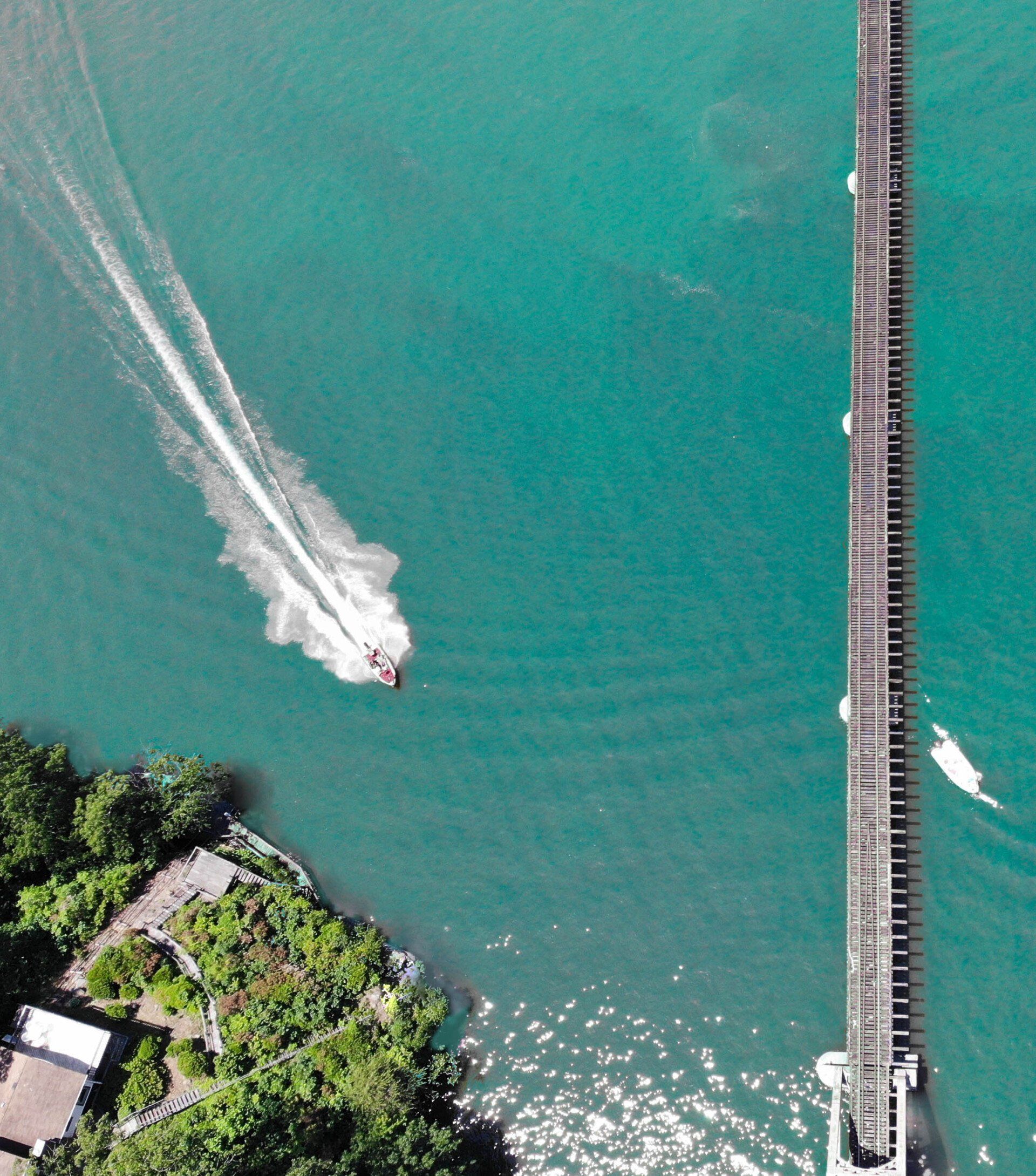 An aerial view of a bridge over a body of water
