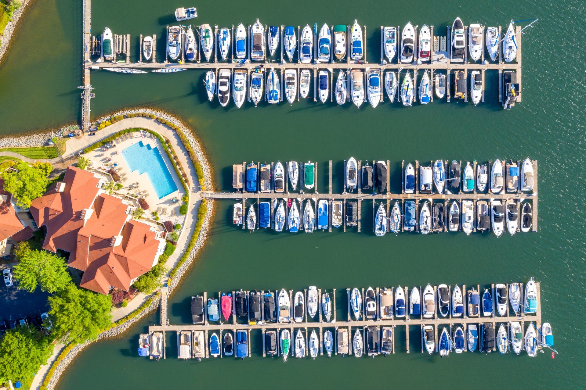 An aerial view of a marina with boats docked in it