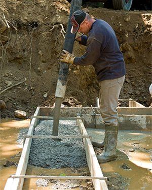 Ready-mix Concrete — Man Pouring Concrete in Southport, NC