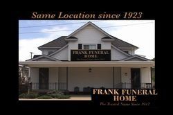 Frank Funeral Home, white building with a sign.
