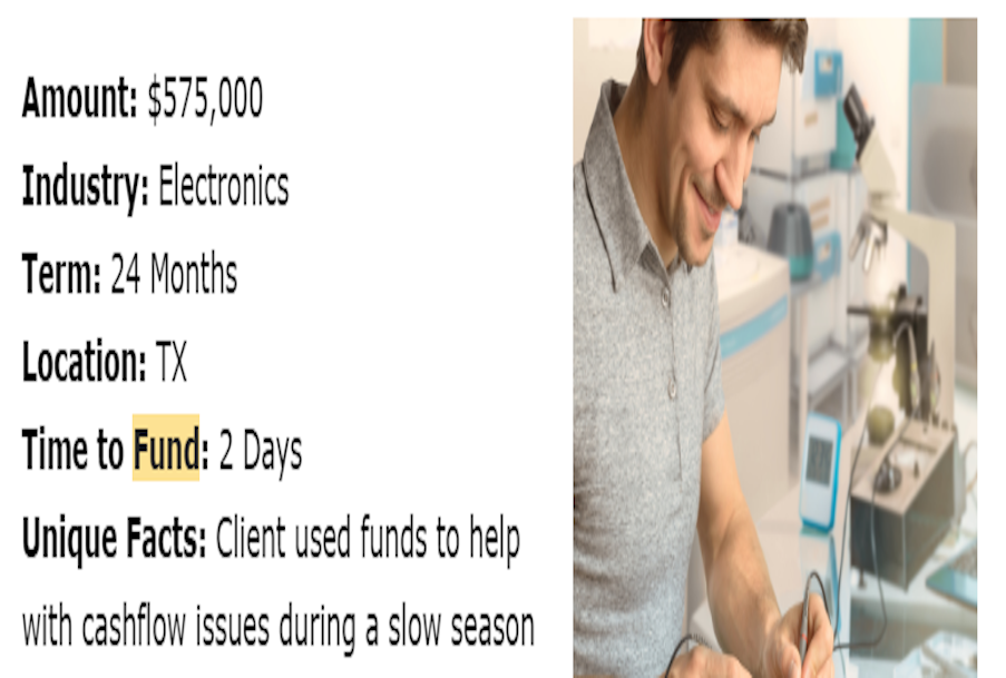 A man in a gray shirt is writing on a piece of paper