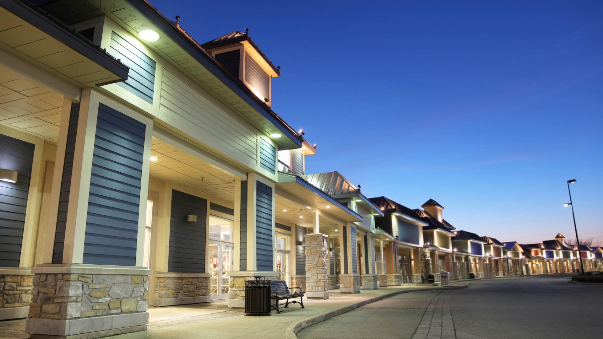 A row of buildings with a blue sky in the background