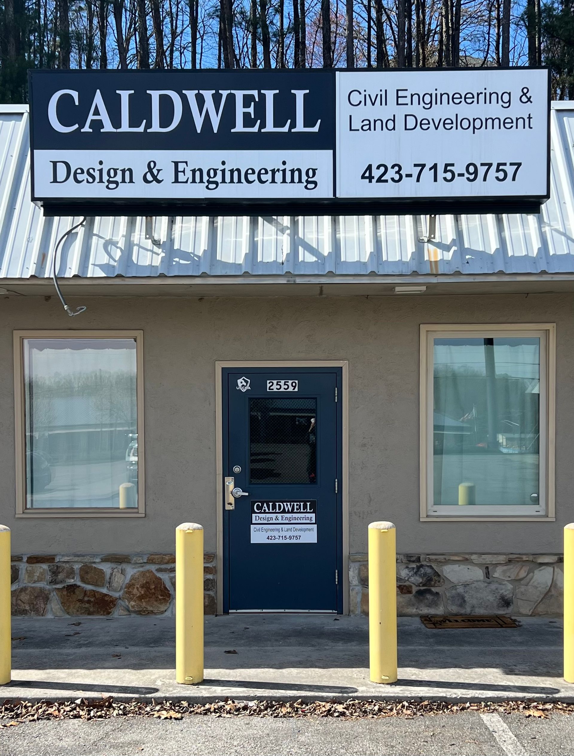 A building with a sign that says caldwell design and engineering