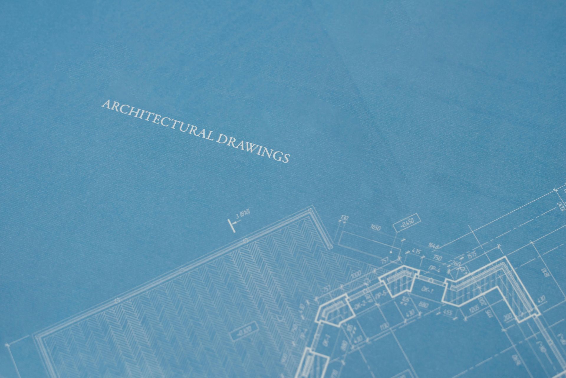 A blueprint of an architectural drawing with the words architectural drawings written on it