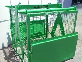 A Green Cage With A Ladder Attached To It Is Sitting On The Ground — Gympie Crane Hire In Glanmire, QLD