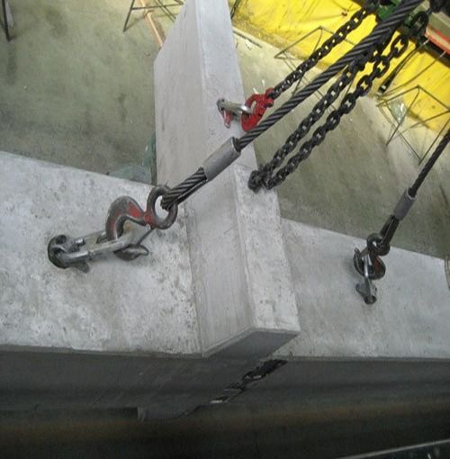 A Piece Of Concrete Is Being Lifted By Chains And Hooks — Gympie Crane Hire In Glanmire, QLD