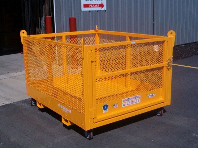 A Yellow Cage With Wheels Sits In A Parking Lot — Gympie Crane Hire In Glanmire, QLD
