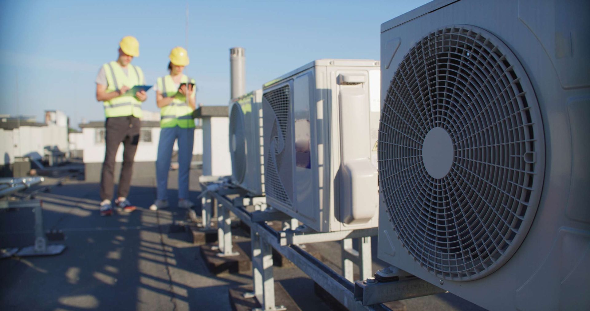 HVAC contractor in Raleigh, NC performing maintenance on an air conditioning unit