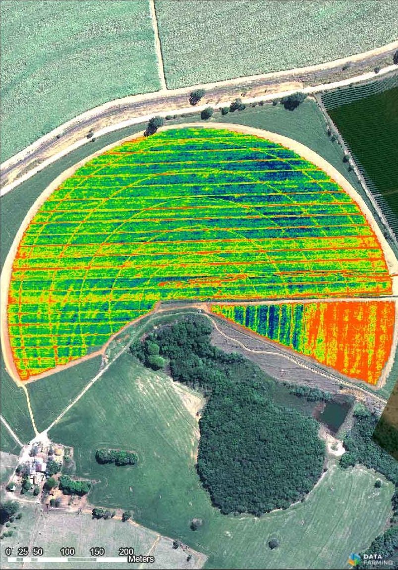 A computer screen shows an aerial view of a field.