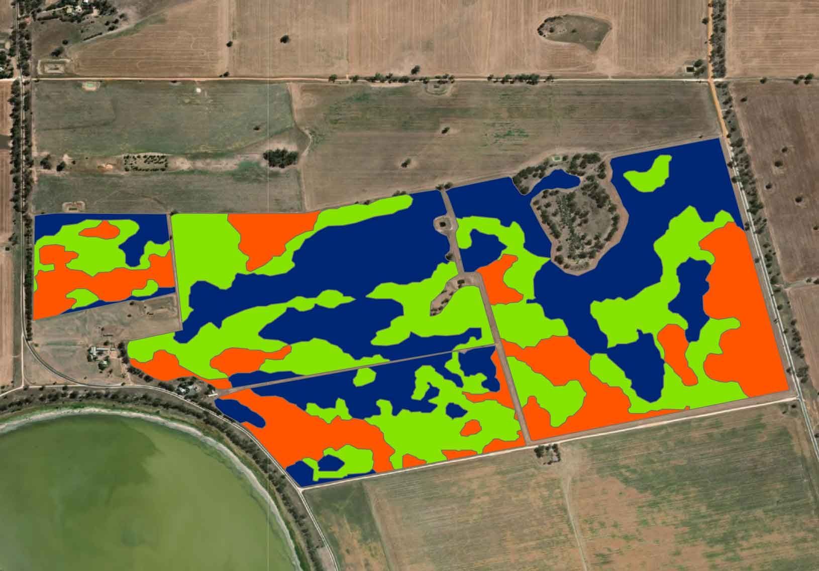 A computer screen shows an aerial view of a field.