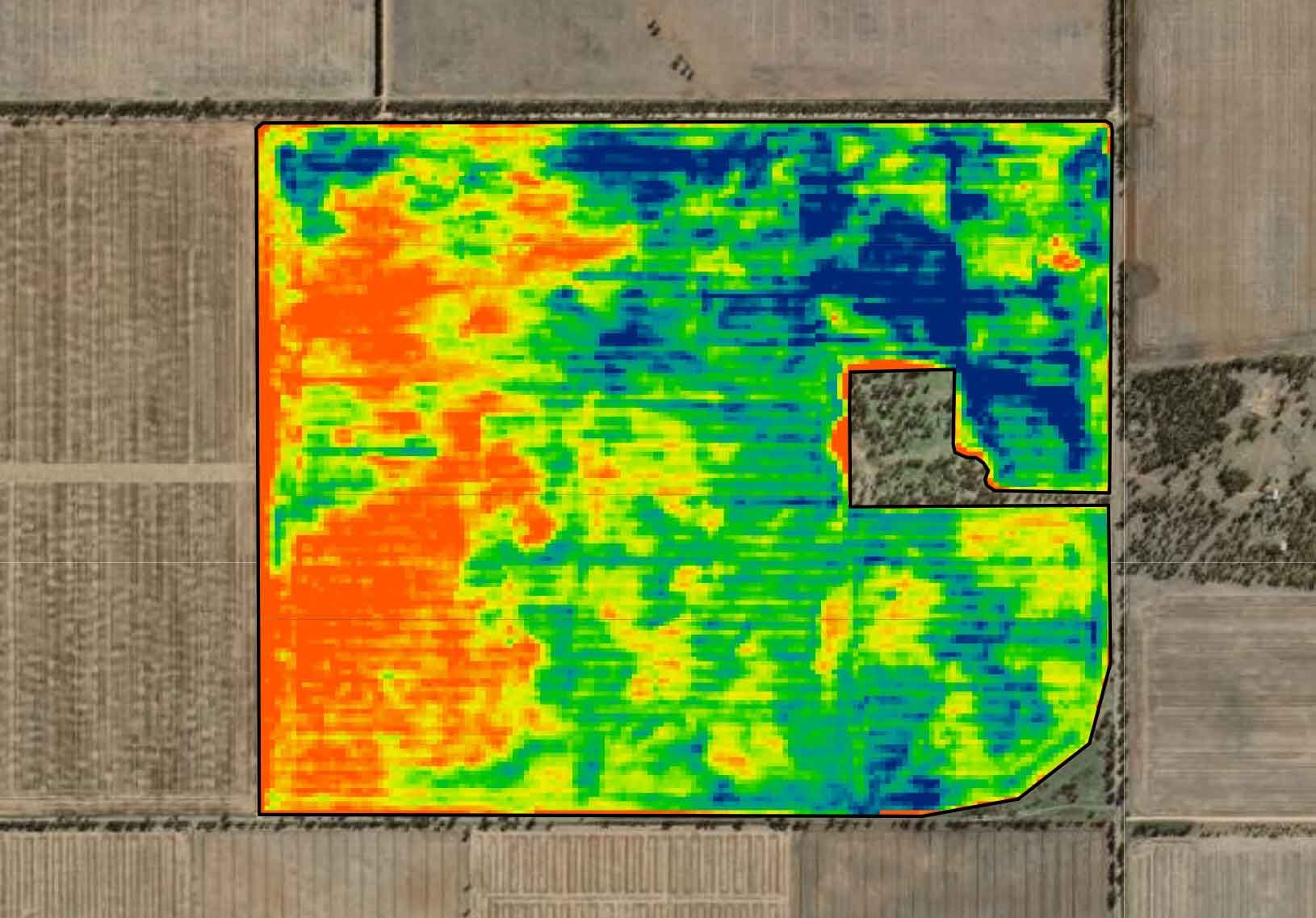 A computer screen shows an aerial view of a field.