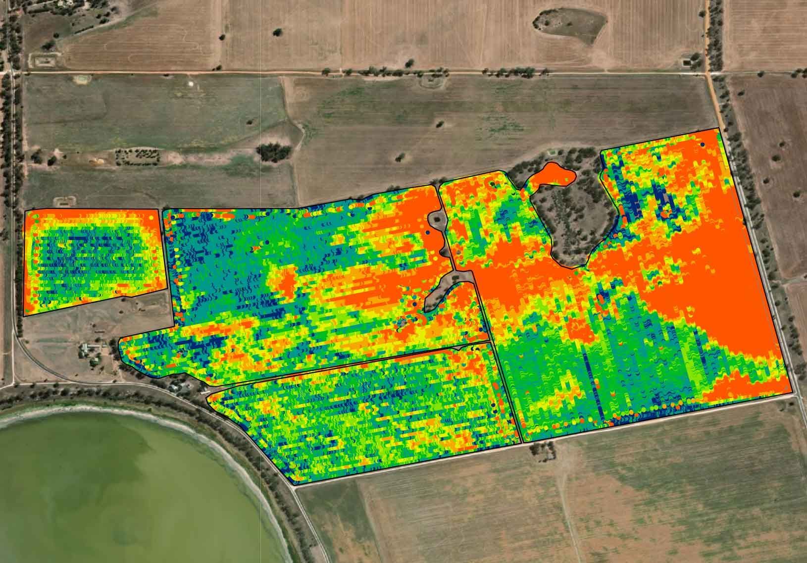 A computer screen shows an aerial view of a field.