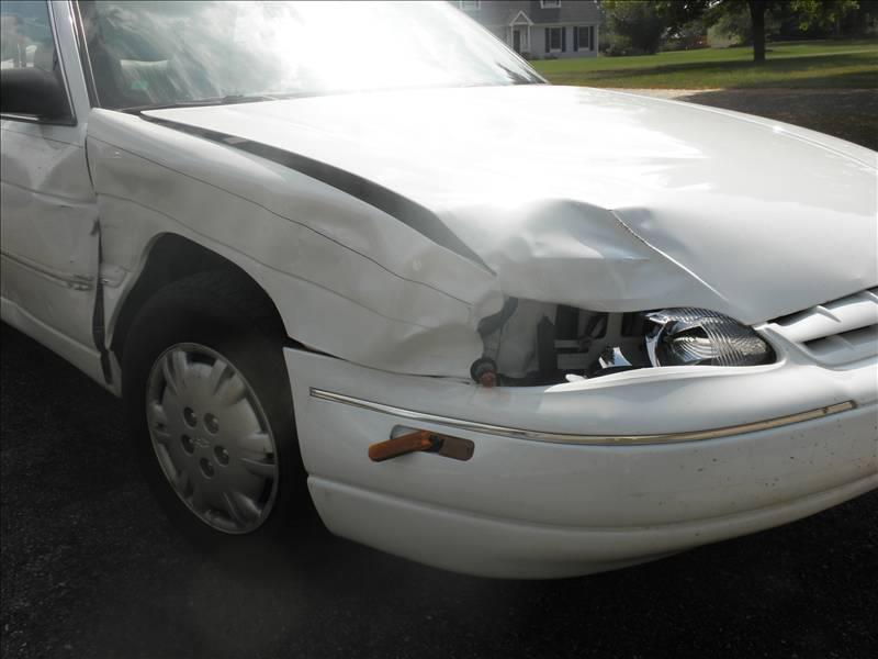 Removing Dent of White Car — Grand Rapids, MI — Bobs Collision Service