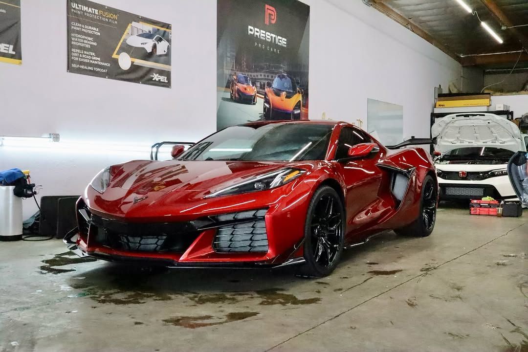 red car with paint protection film inside Prestige Pro Care shop