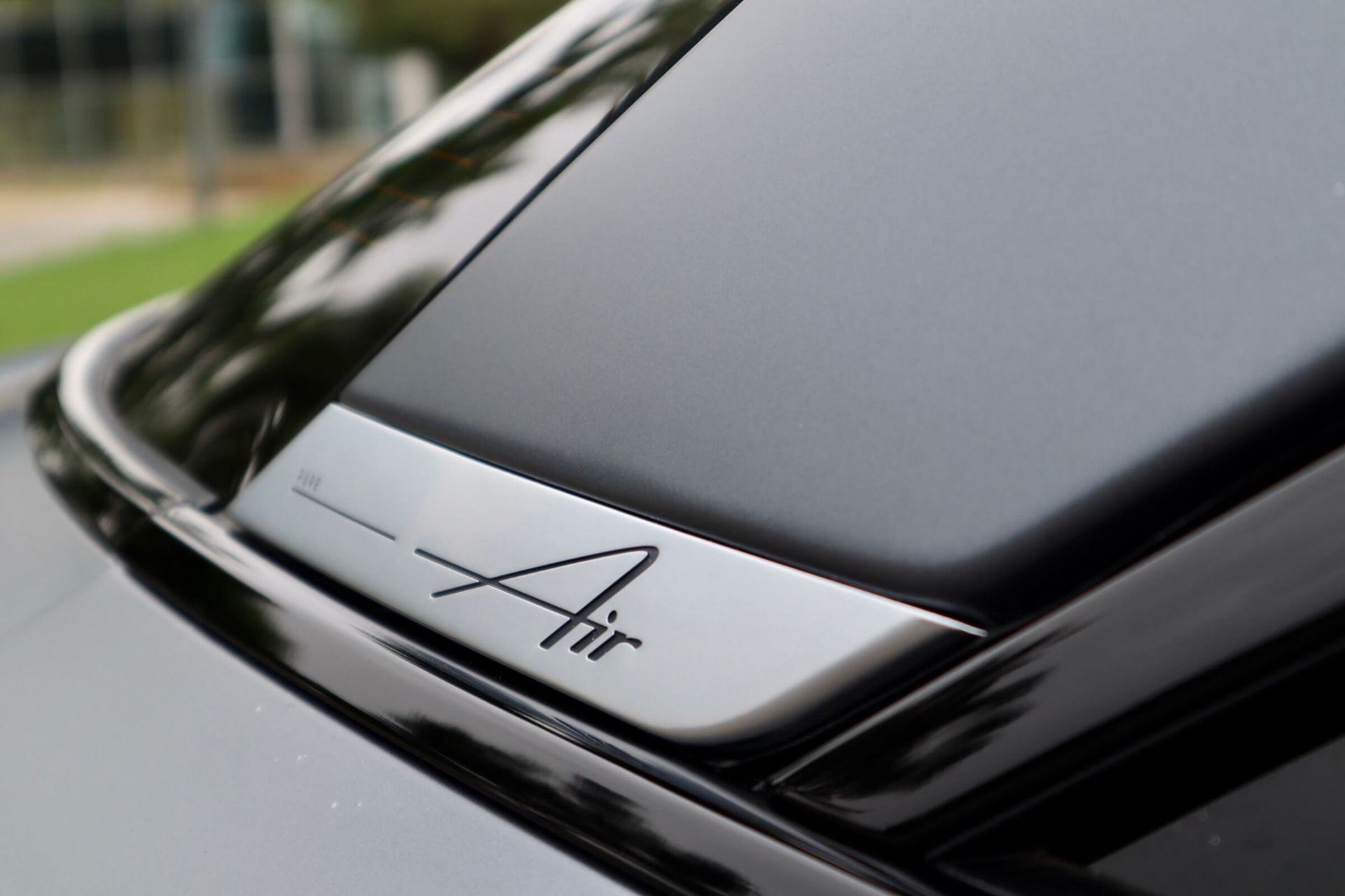 A black car with the word air on the hood