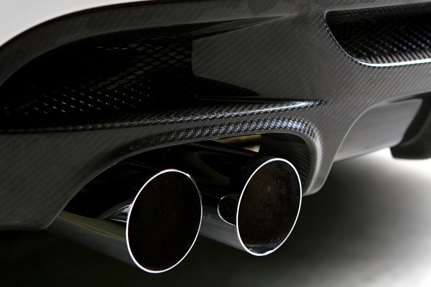 A close up of the exhaust pipes of a car