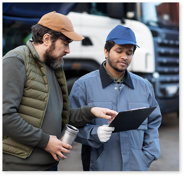 Door-to-port car shipping service picking up a white luxury sports car on an open carrier trailer in a residential neighborhood