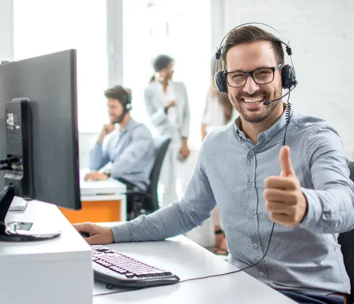 Auto transport carrier loading luxury SUVs at the port terminal with shipping cranes in the background for mainland delivery