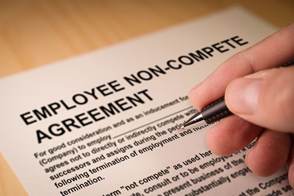 Employee consulting with an employment lawyer in Denver about non-compete agreements.