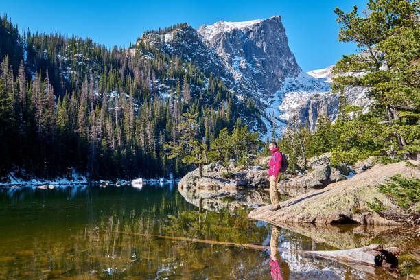 Summer intern at Dream Lake, Colorado, enjoying time off during a youth internship program.