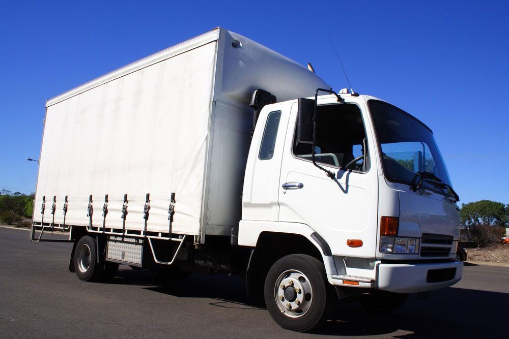 White Truck Sideview — Hines Refrigerated Transport in Kundabung, NSW