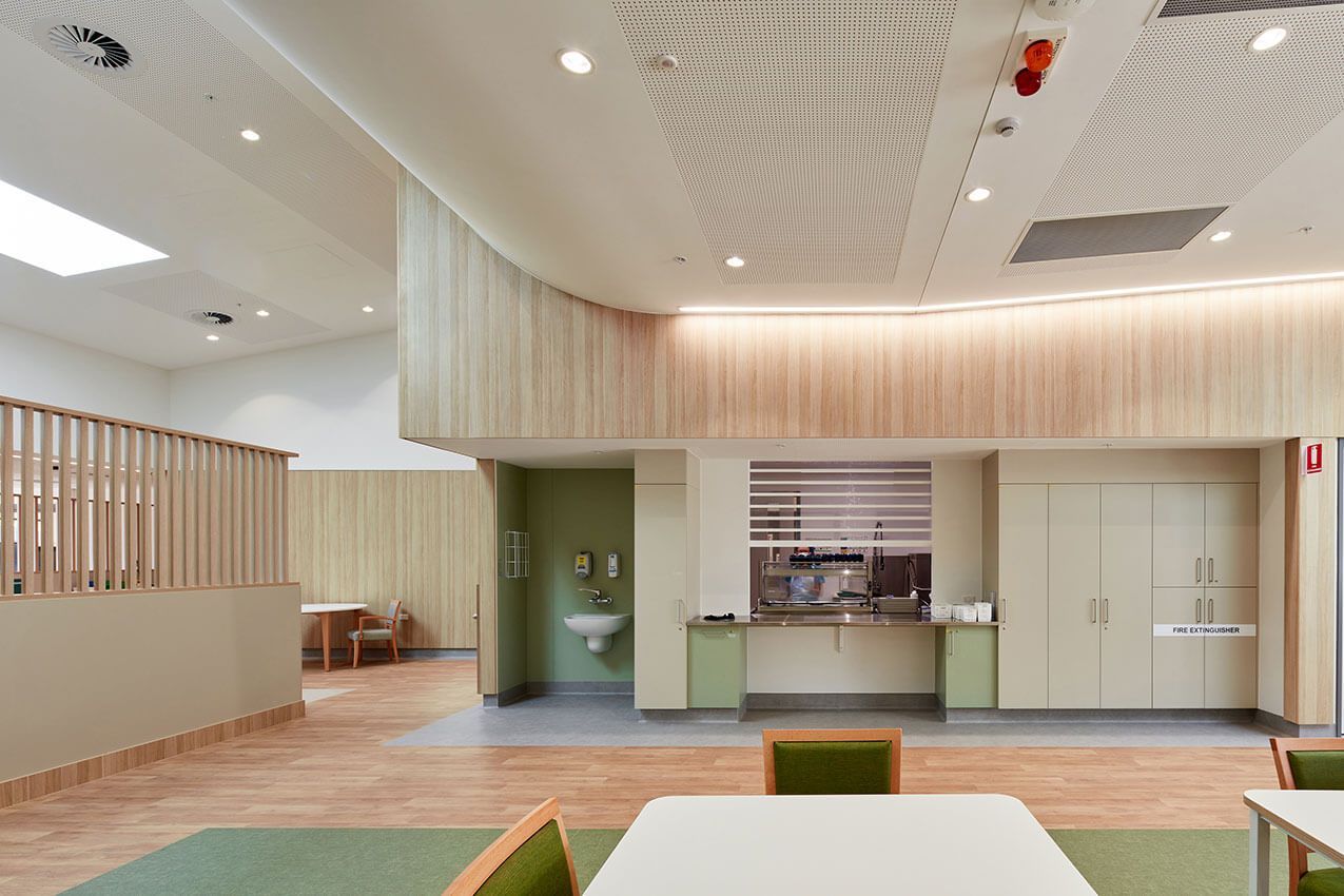 A large room with tables and chairs in it.