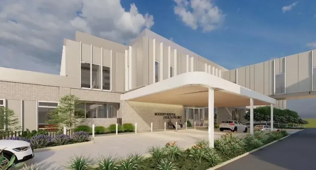 An artist 's impression of a hospital with a car parked in front of it.