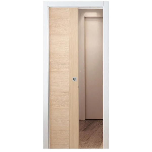 A wooden sliding door with a white frame is open to a room.