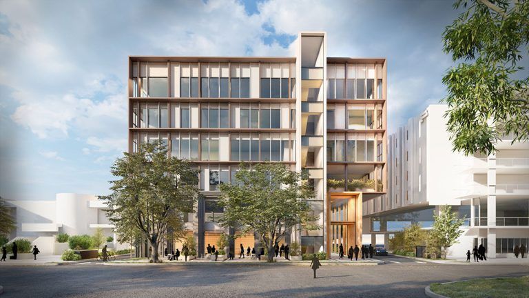 A large building with a lot of windows is surrounded by trees and people.