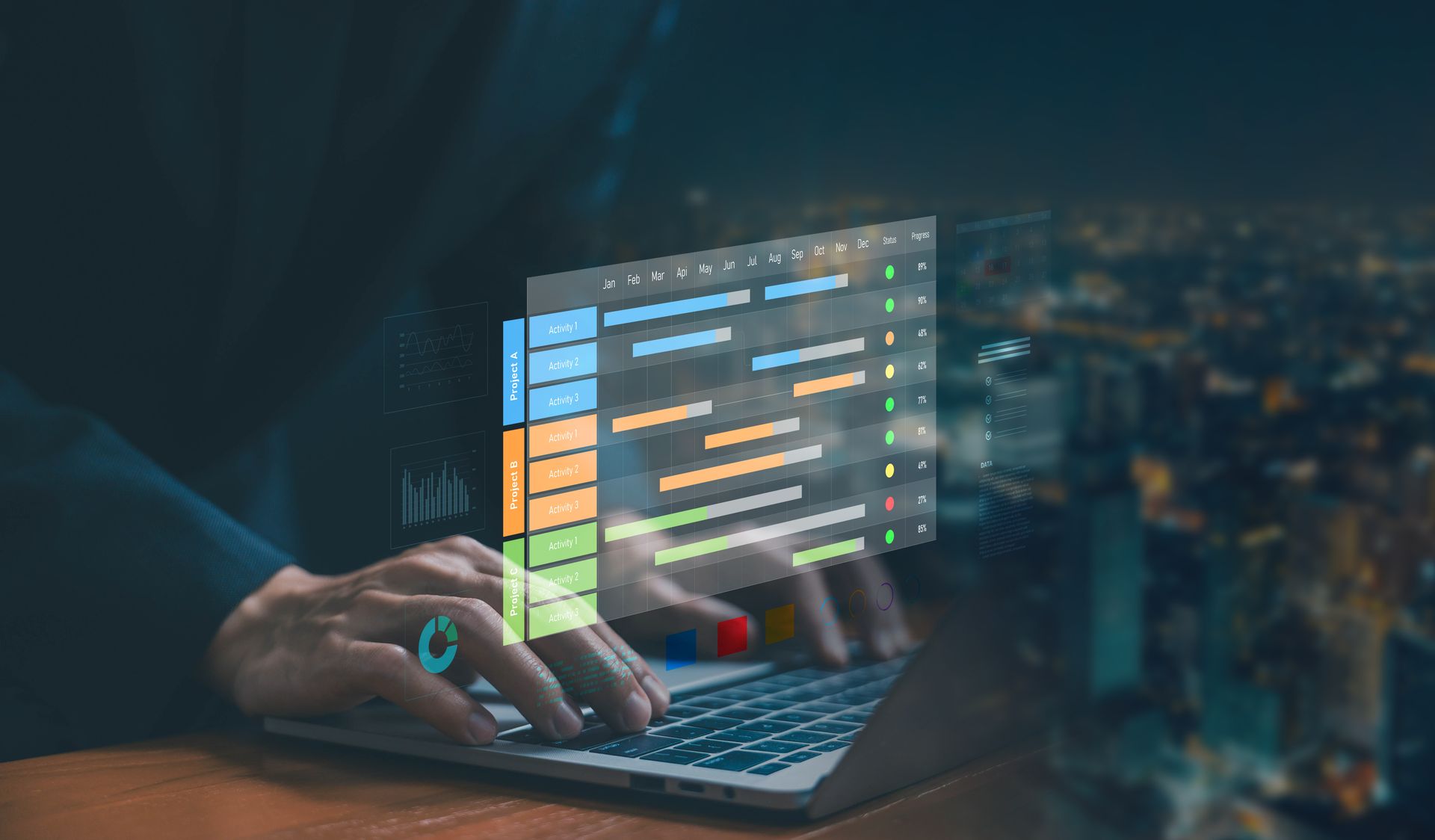 Woman with glasses working on a laptop at a desk in an office.