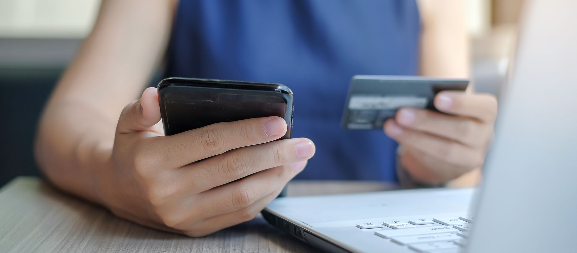 Image of a person making a payment online