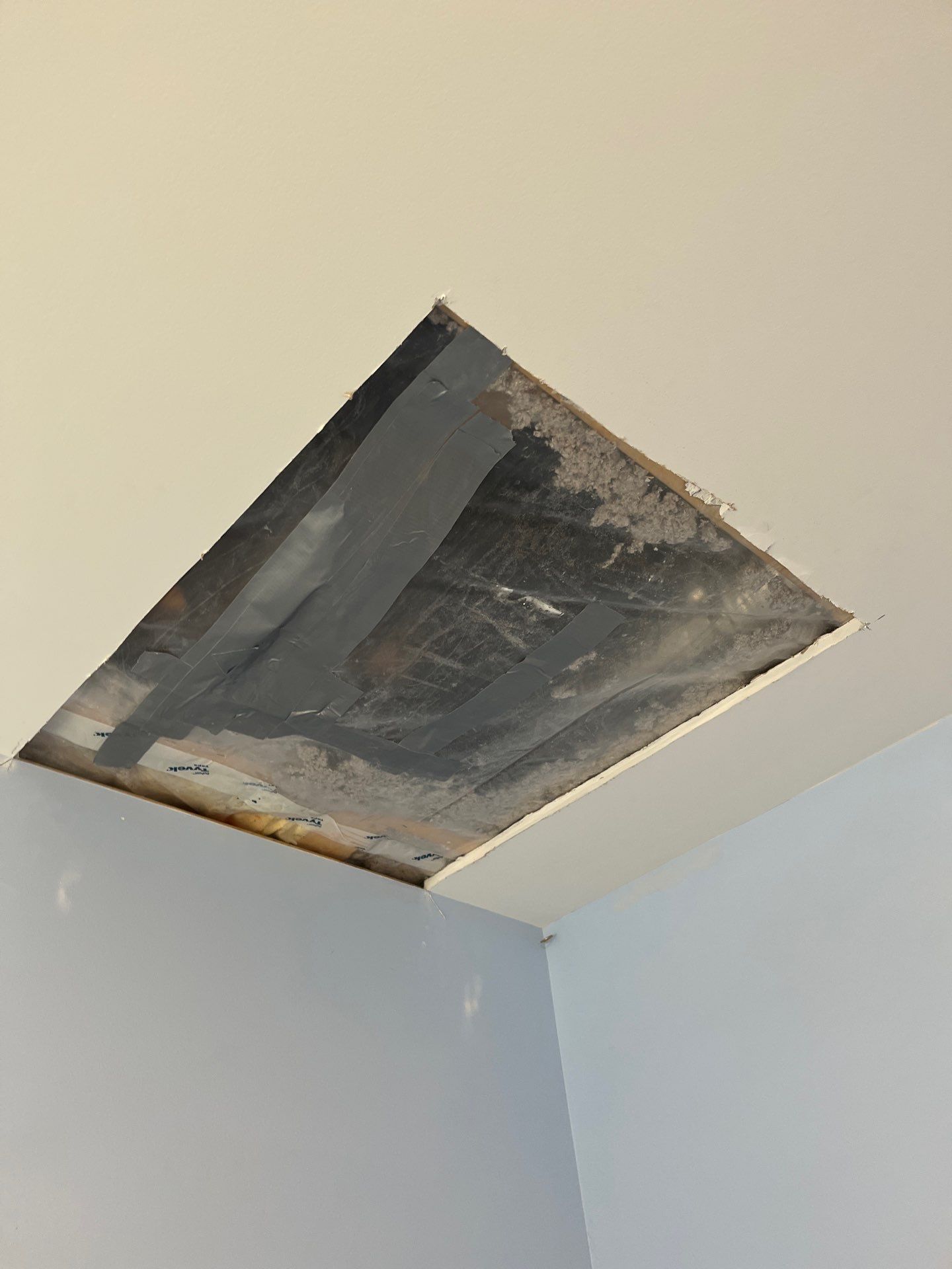 A hole in the ceiling of a room.