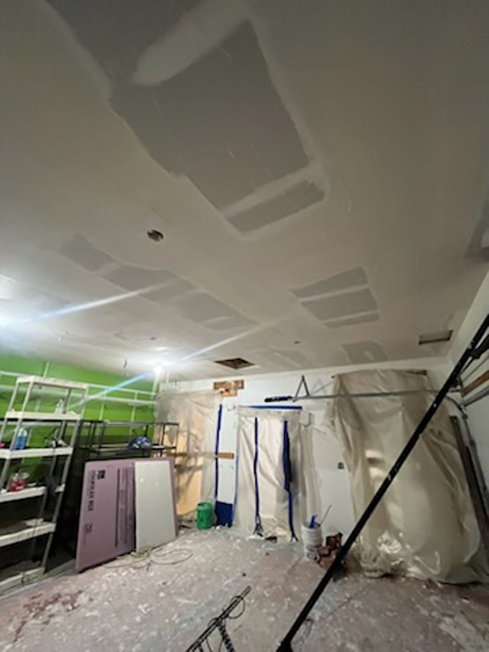 A room with a ceiling that is being remodeled.