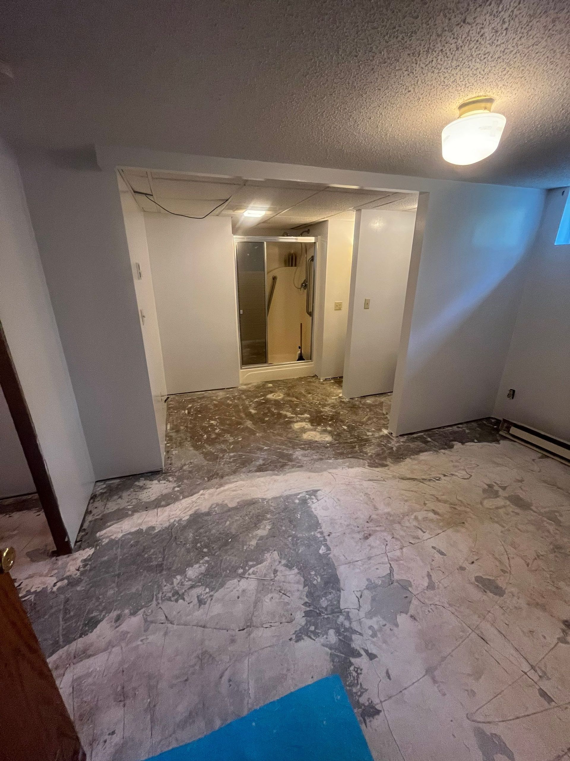 A basement with a lot of dirt on the floor and walls.