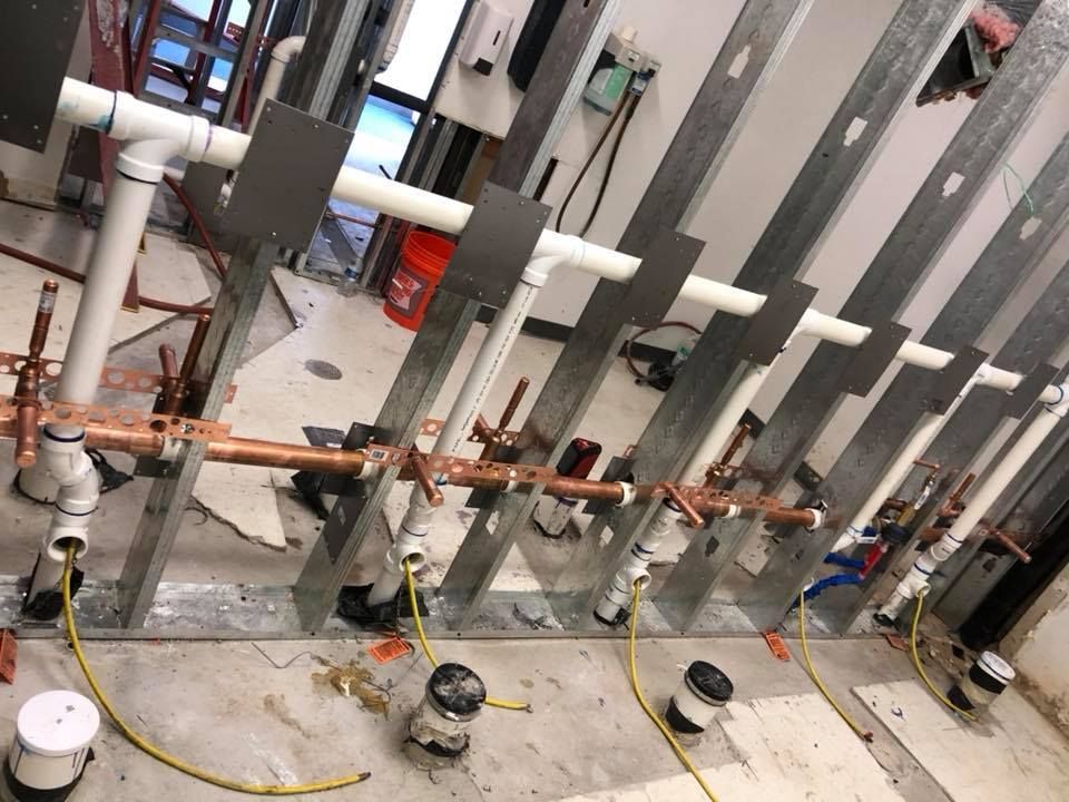A row of pipes are lined up in a room.