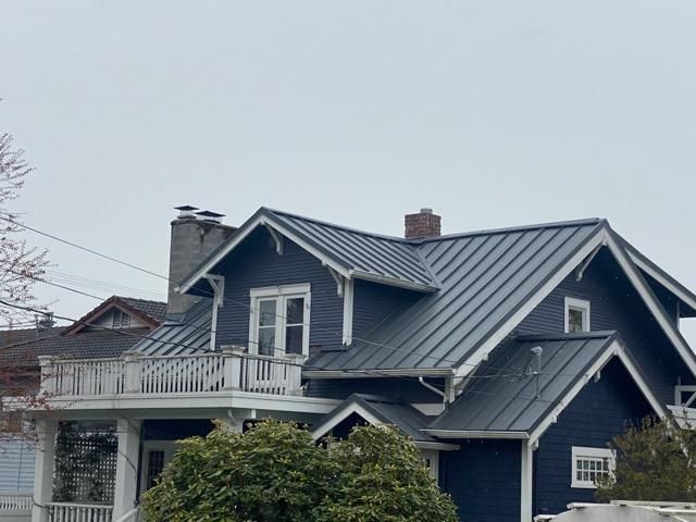 Durable standing seam metal roof for a residential property in Kent, WA.