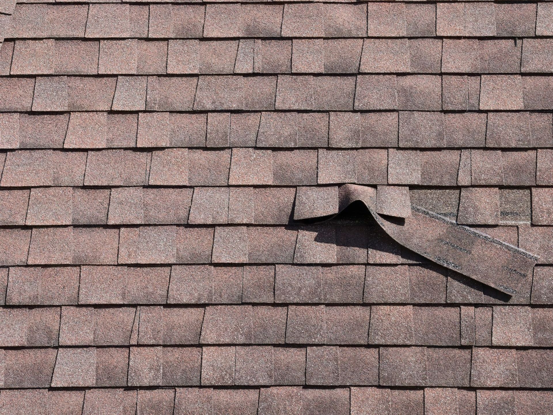 A close up of a roof with a hole in it.