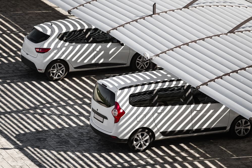 Two White Cars Parked Under a Slatted White Canopy — BCV Storage Centre in Wauchope, NSW