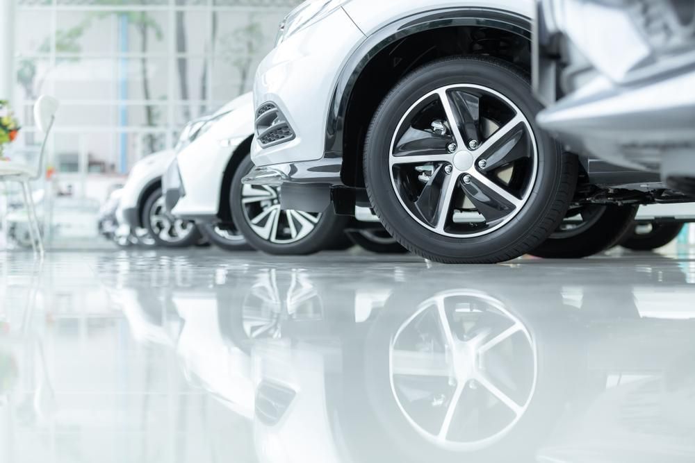 Row of Shiny Silver Cars Parked on a Reflective Floor in a Showroom — BCV Storage Centre in Laurieton, NSW