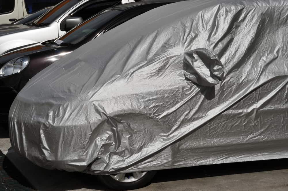 Silver Car Cover on a Car Parked Next to Another Car — BCV Storage Centre in Lake Cathie, NSW