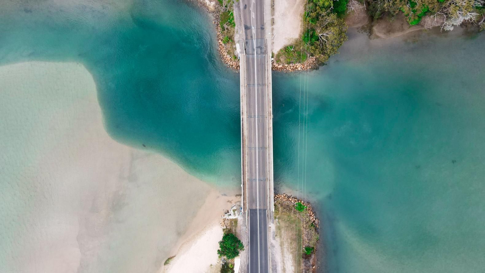 Aerial View of a Bridge Spanning Turquoise Water — BCV Storage Centre in Lake Cathie, NSW