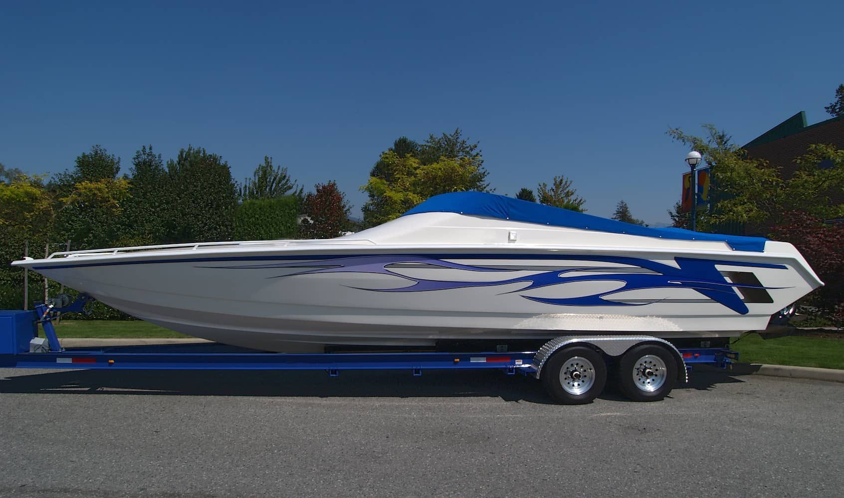 White Speedboat on a Blue Trailer, Covered With a Blue Tarp — BCV Storage Centre in Bonny Hills, NSW